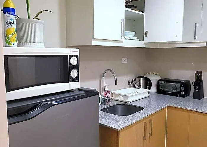 Отель Staycations Up Above 13 At Bgc
